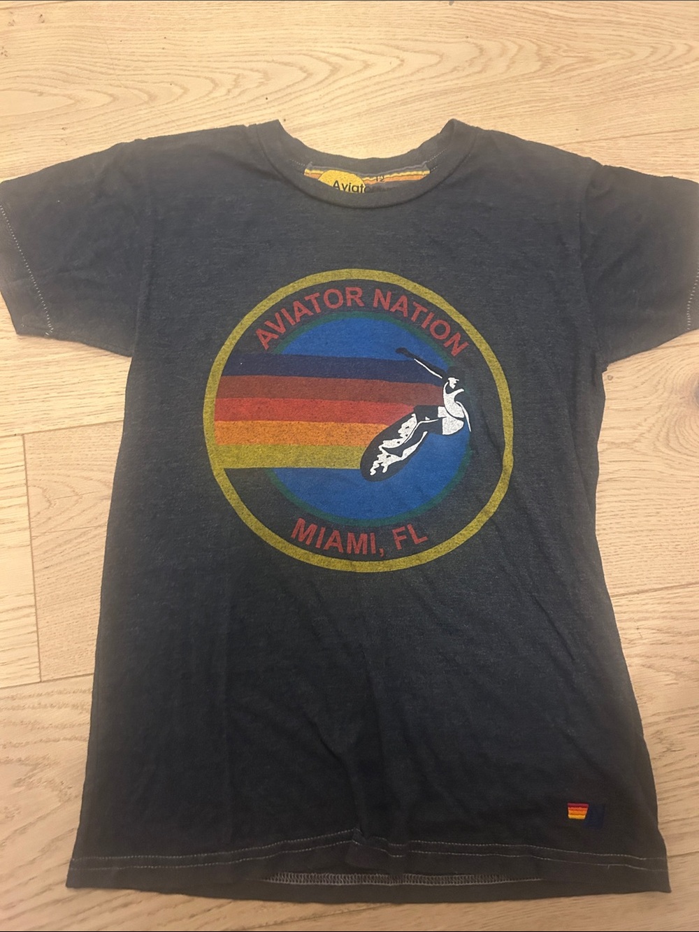 Aviator Nation Black Kids Tee with Retro Rainbow Surf Graphic